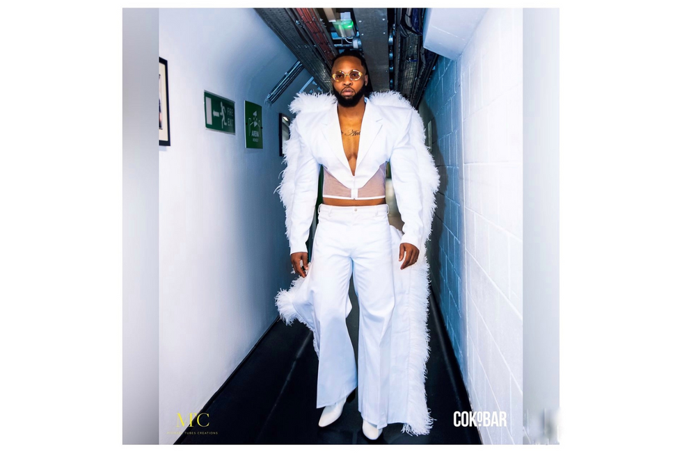 Flavouru2019s white feather-trimmed suit with a see-through corset is by South African designer Rich Mnisi.