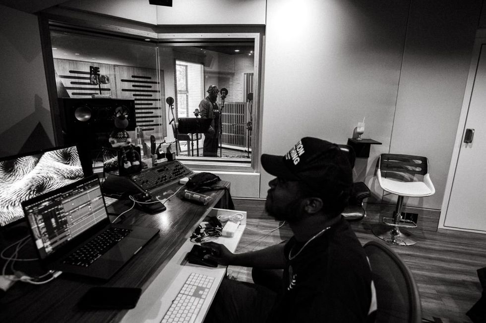 A photo of PJ Morton and a producer during a recording session in Johannesburg.